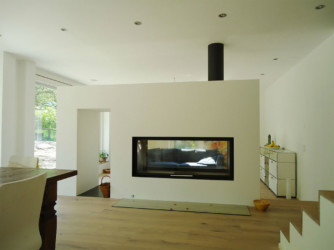 Cheminée de salon 2 faces tunnel avec feu de bois